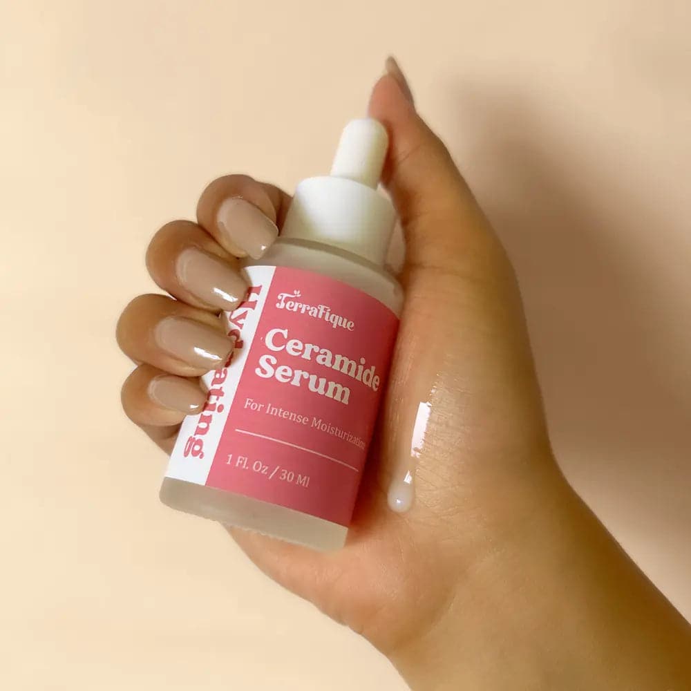 Woman holding Terrafique Ceramide Serum