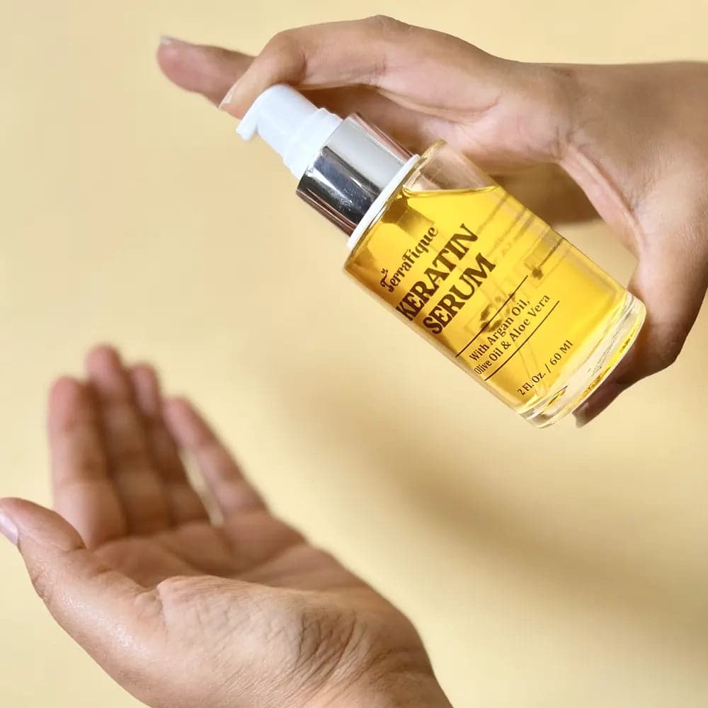 woman applying terrafique keratin serum